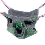 Green polka dot pet hammock with gray fur lining showing interior tunnel design