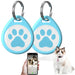 Two blue paw print pet ID tags with smartphone showing tracking app and ragdoll cat wearing tag