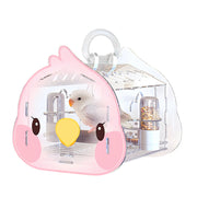 Pink acrylic bird carrier with cute face design containing white bird, food dispensers visible
