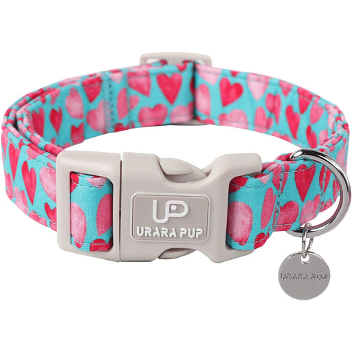 Pink heart patterned dog collar with teal background and gray quick-release buckle and tag
