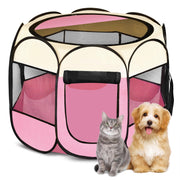 Pink portable pet playpen with mesh panels and zippered door, gray cat and golden dog sitting