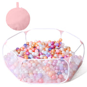 Pink hexagonal pop-up ball pit filled with colorful pastel balls with folded storage bag