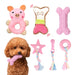 Pink puppy toy set with bear rattle, squeaky bone, teething toys and rope toys displayed