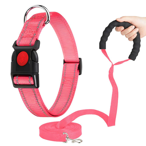 Pink reflective martingale dog collar with black buckle, matching leash and padded handle