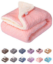 Pink sherpa-lined pet blanket folded with white fuzzy interior visible and color swatches below