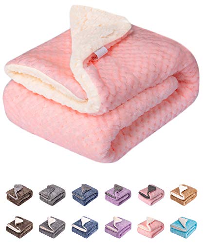 Pink sherpa-lined pet blanket folded with white fuzzy interior visible and color swatches below