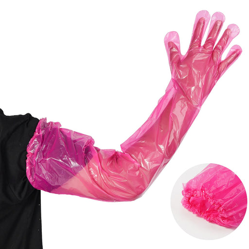 Person wearing long pink disposable veterinary glove with arm fully extended showing coverage