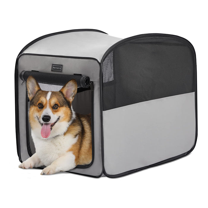 Gray and black portable dog crate with mesh panels and corgi sitting inside front opening