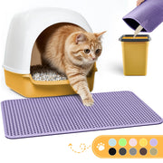 Orange tabby kitten stepping from yellow litter box onto purple textured cat litter mat