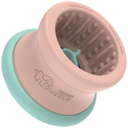 Pink and mint puzzle feeder bowl showing textured interior with raised bumps and grooves