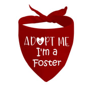 Red triangular dog bandana with white Adopt Me I'm a Foster text and paw print heart