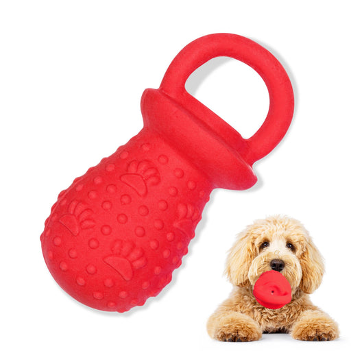 Red textured pacifier-shaped dog chew toy with handle next to golden doodle holding similar toy