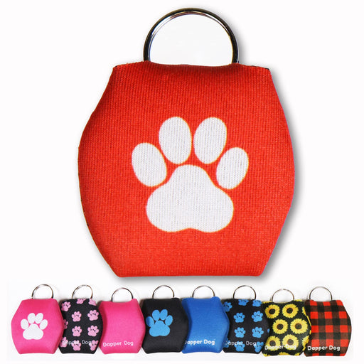 Red fabric dog tag silencer with white paw print and metal ring shown in multiple color variants