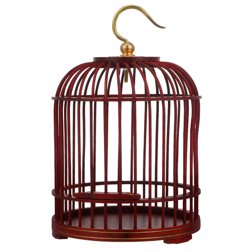 Red wooden bird cage with brass hook and vertical slat design on white background