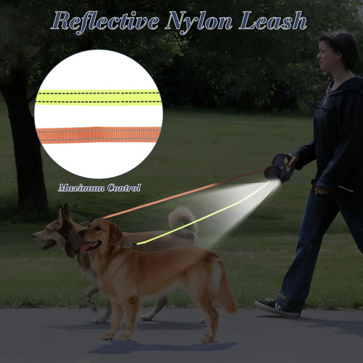 Woman walking two dogs at dusk with reflective nylon leash featuring yellow and orange stripes
