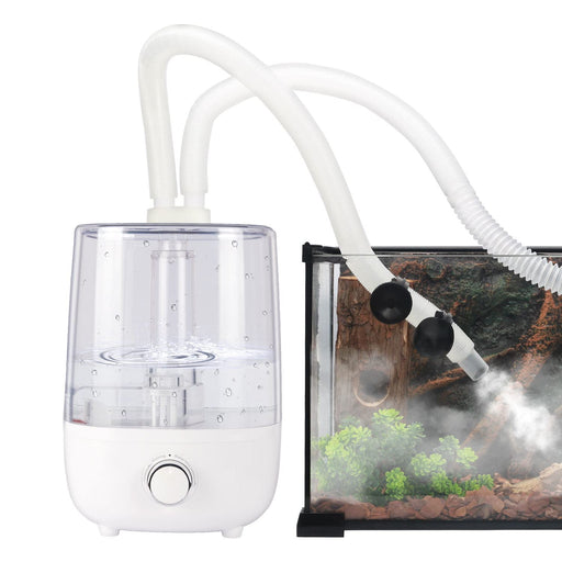 White reptile fogger humidifier with clear water tank connected to terrarium producing mist