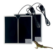 Two black reptile heat mats with power cords and a small lizard shown for scale