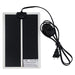 Black rectangular reptile heating pad with power cord and safety warning label visible