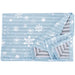 Light blue cooling dog blanket with white snowflake pattern showing reversible gray striped side