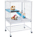 White rolling guinea pig cage with multi-level platforms and three guinea pigs inside