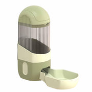 Side view of sage green automatic pet feeder with clear dispensing chamber and feeding bowl