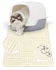 White and cream silicone cat litter mat with drainage channels and fluffy kitten emerging from