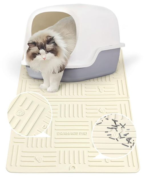 White and cream silicone cat litter mat with drainage channels and fluffy kitten emerging from