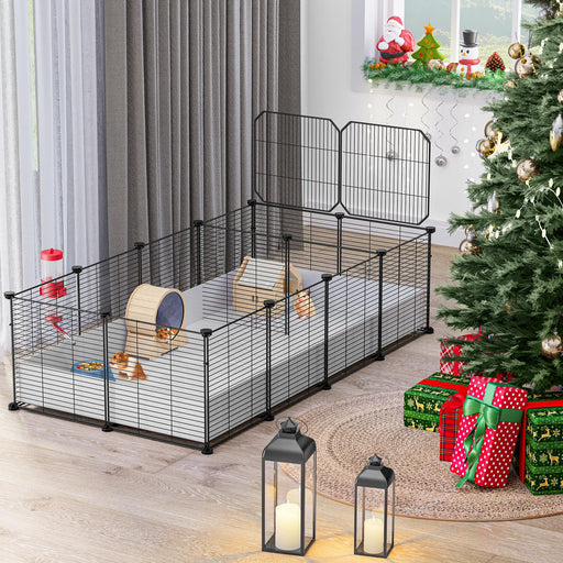 Large black wire guinea pig cage with wooden hideout and accessories in festive living room