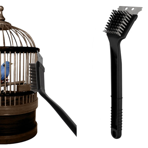 Black stainless steel bird cage cleaning brush with wire bristles next to wooden birdcage