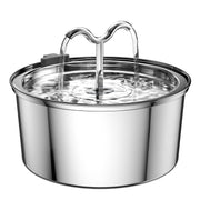 Stainless steel pet water fountain with dual flowing spouts and clear water showing ripples
