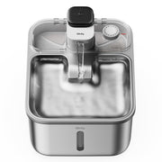 Stainless steel wireless cat water fountain with timer dial and transparent lid showing internal
