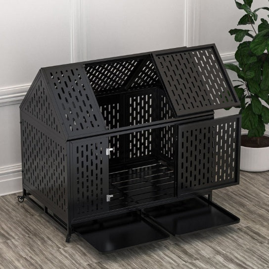 Black steel dog kennel with house-shaped roof and ventilation holes on wooden floor