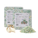 Green mixed paper bedding packages with hamster and bedding pile displayed on white background