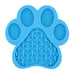 Blue paw-shaped licking mat with textured cross patterns and dotted grip areas