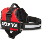 Red therapy dog harness with black straps and white reflective patch on black webbing