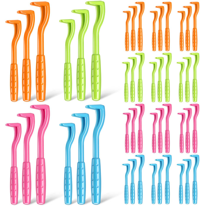 Colorful tick removal tools arranged in groups showing orange, green, pink and blue varieties