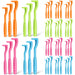 Colorful tick removal tools arranged in groups showing orange, green, pink and blue varieties