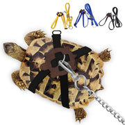 Black adjustable leather harness with chain leash fitted on a tortoise shell top view