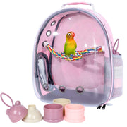 Pink transparent bird backpack carrier with lovebird perched on colorful rope, accessories displayed