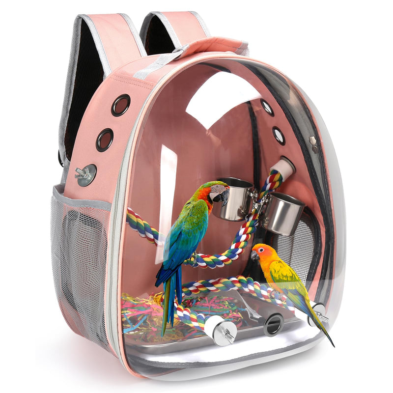 Pink transparent bird carrier backpack showing two colorful parrots inside with perches and toys