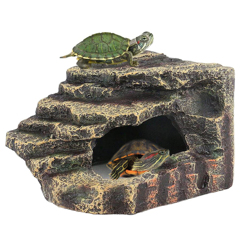 Natural rock reptile basking platform with two turtles, one on top and one inside cave opening