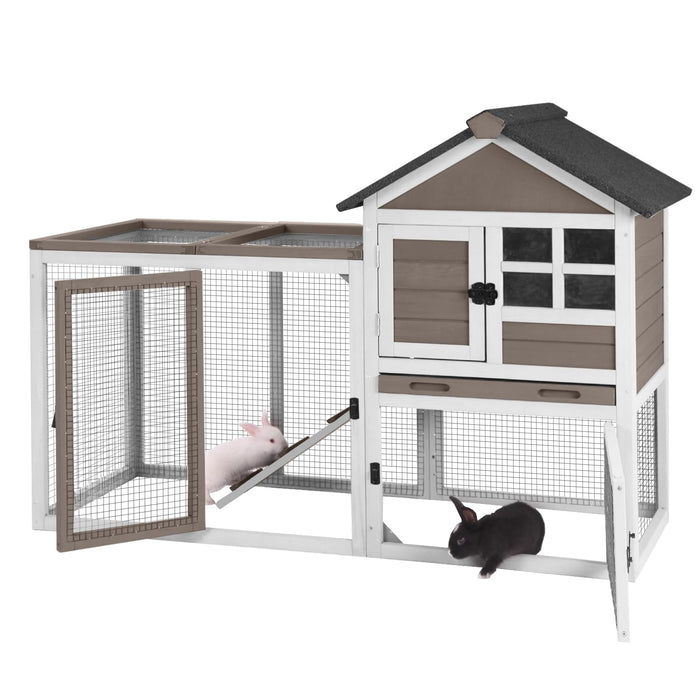 Two-story rabbit hutch with white and brown wood, mesh run area, and two rabbits inside
