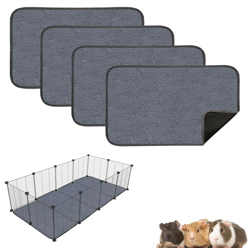 Gray washable cage liners stacked with corner folded up, wire pet enclosure and guinea pigs below
