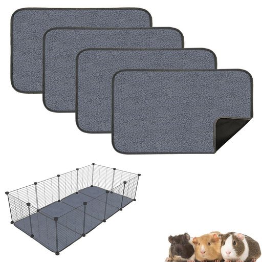 Gray washable cage liners stacked with corner folded up, wire pet enclosure and guinea pigs below