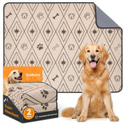 Loobani 2-pack washable dog pee pads in beige with paw print pattern beside golden retriever