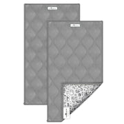 Two gray quilted guinea pig cage liners showing waterproof backing with pet-themed pattern