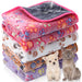 Stack of colorful waterproof pet blankets with paw prints next to small dog and gray cat