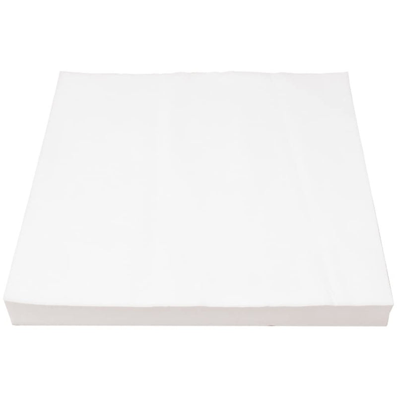 Stack of white disposable bird cage liner papers shown at an angle on white background