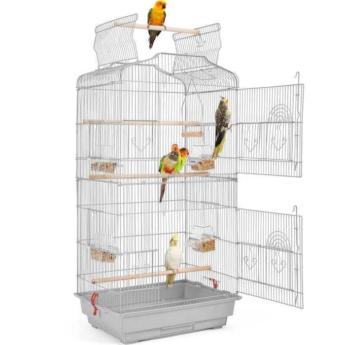 White wire bird cage with open doors showing multiple colorful parrots perched on wooden dowels