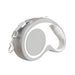 Gray retractable dog leash with white handle grip shown from side angle with metal clip